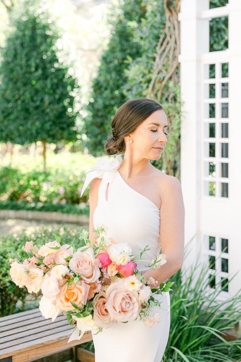 bride holding pink bridal bouquet
