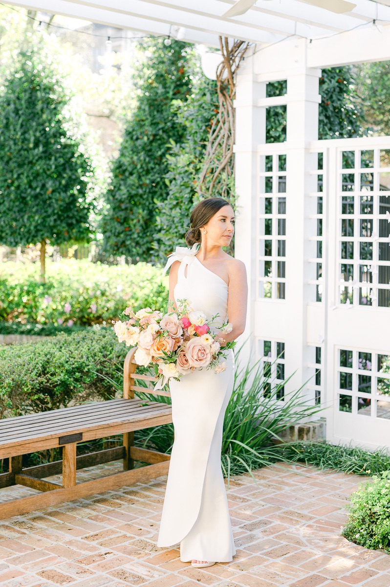 bride holding pink bridal bouquet