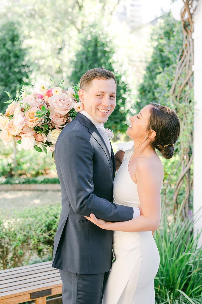 groom smiling with bride