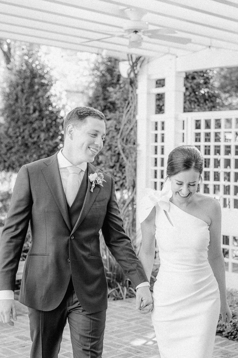 bride and groom walking and laughing