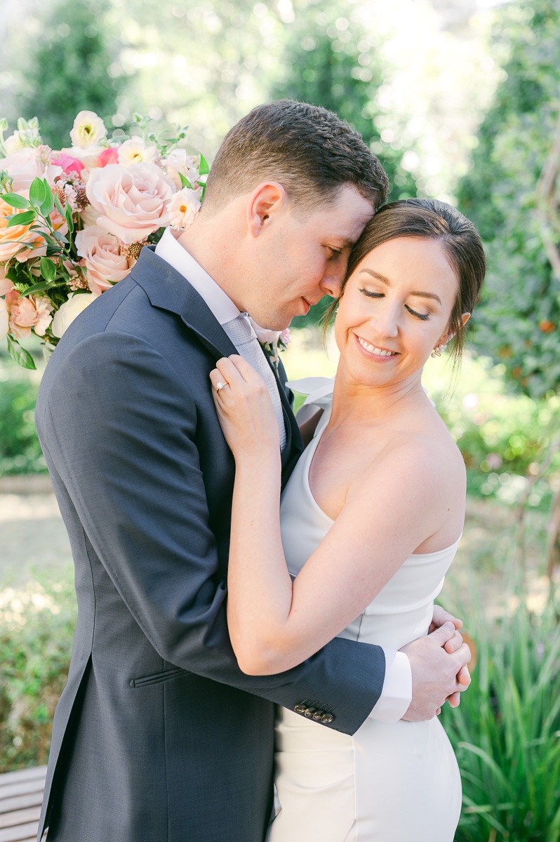 bride and groom cuddling before wedding in Houston