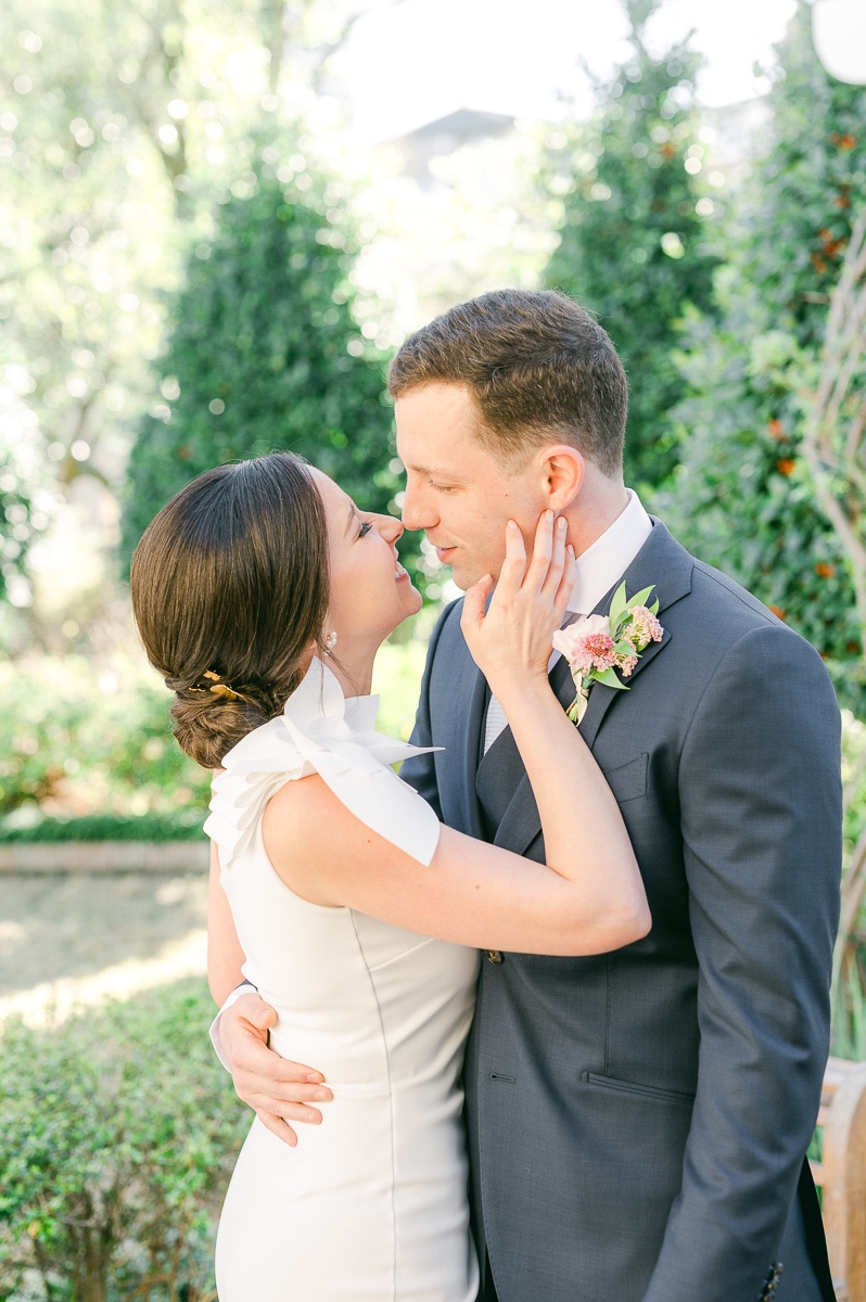 bride and groom cuddling before wedding in Houston