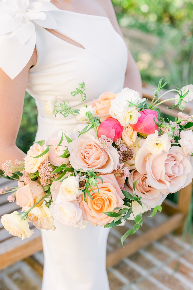 bride holding pink bridal bouquet