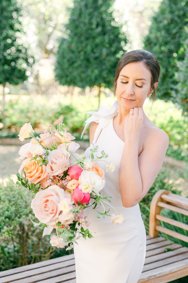 bride holding pink bridal bouquet