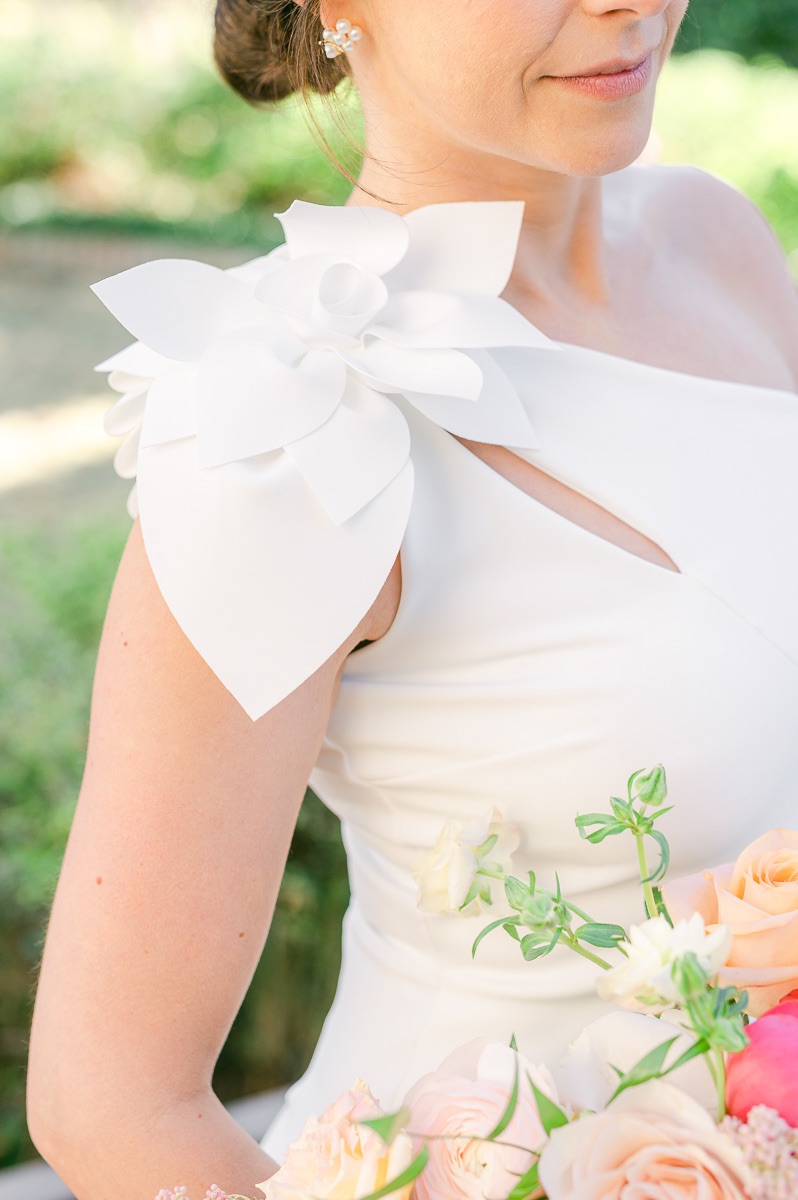 wedding dress detail of flower on shoulder 