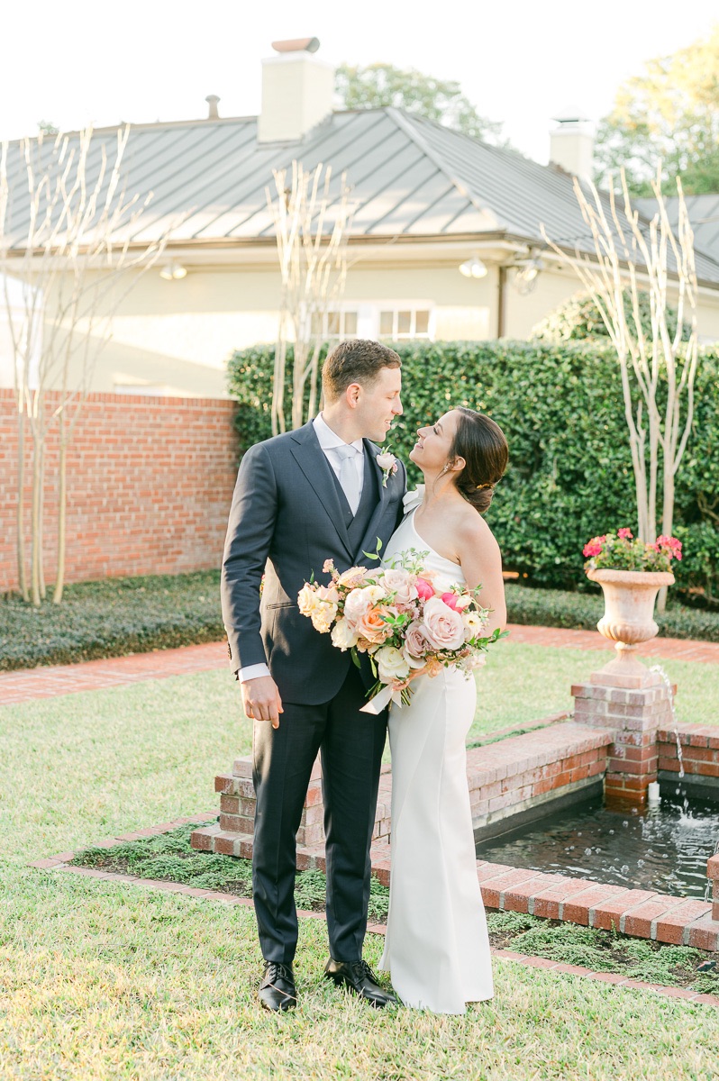 couple near fountain at river oaks garden club