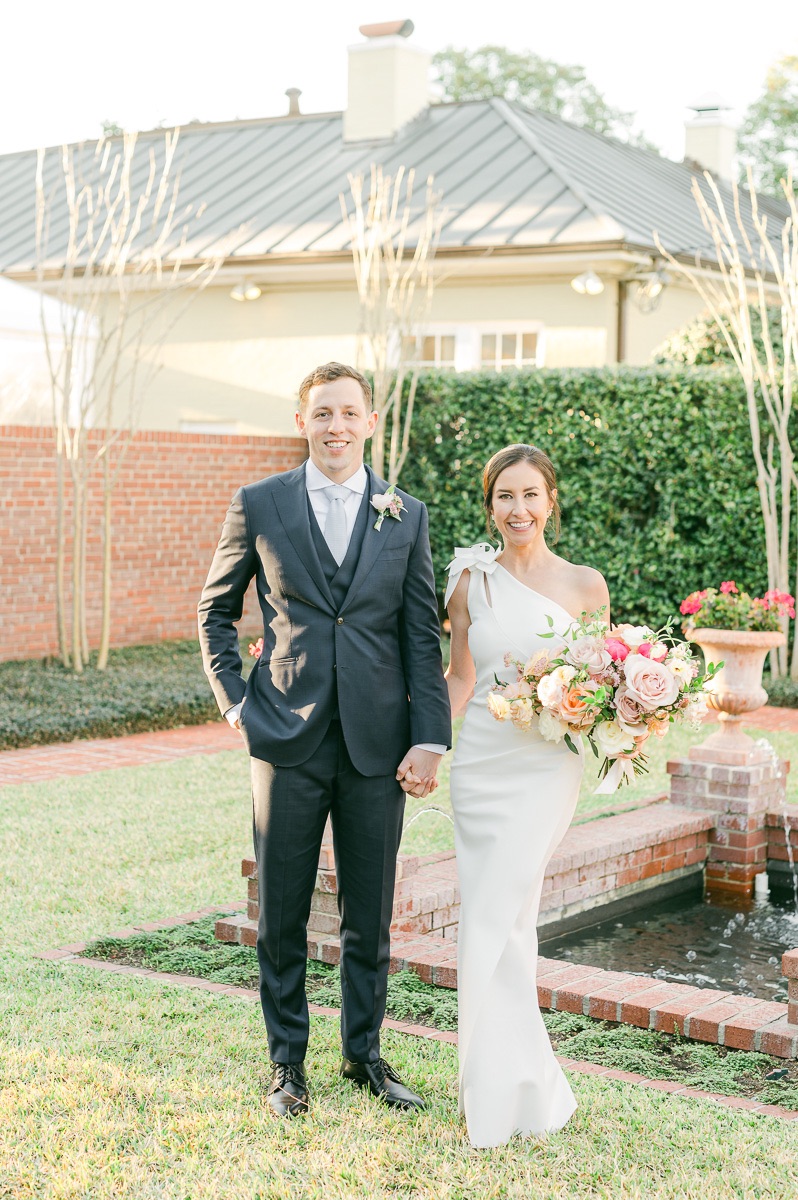 couple near fountain at river oaks garden club