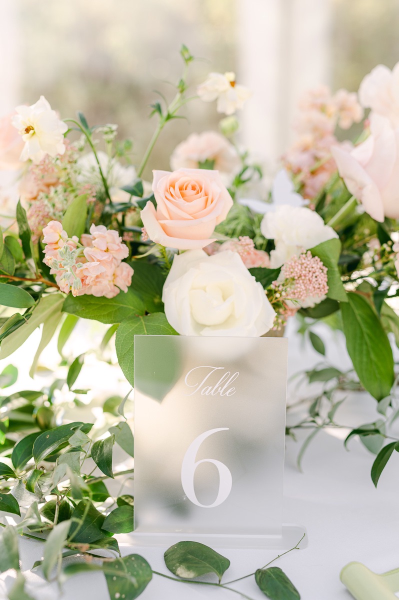 pink and white flowers and table number in Houston