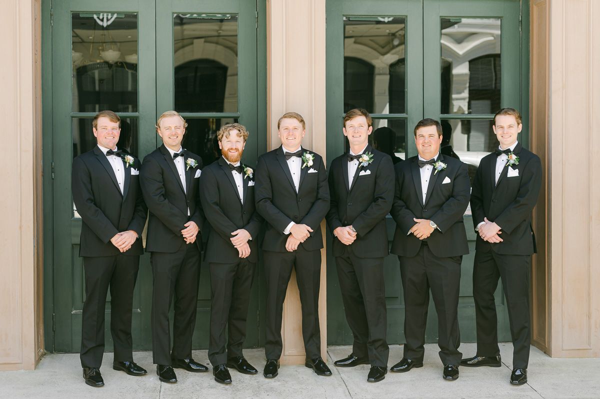 groomsmen outside Galveston wedding venue