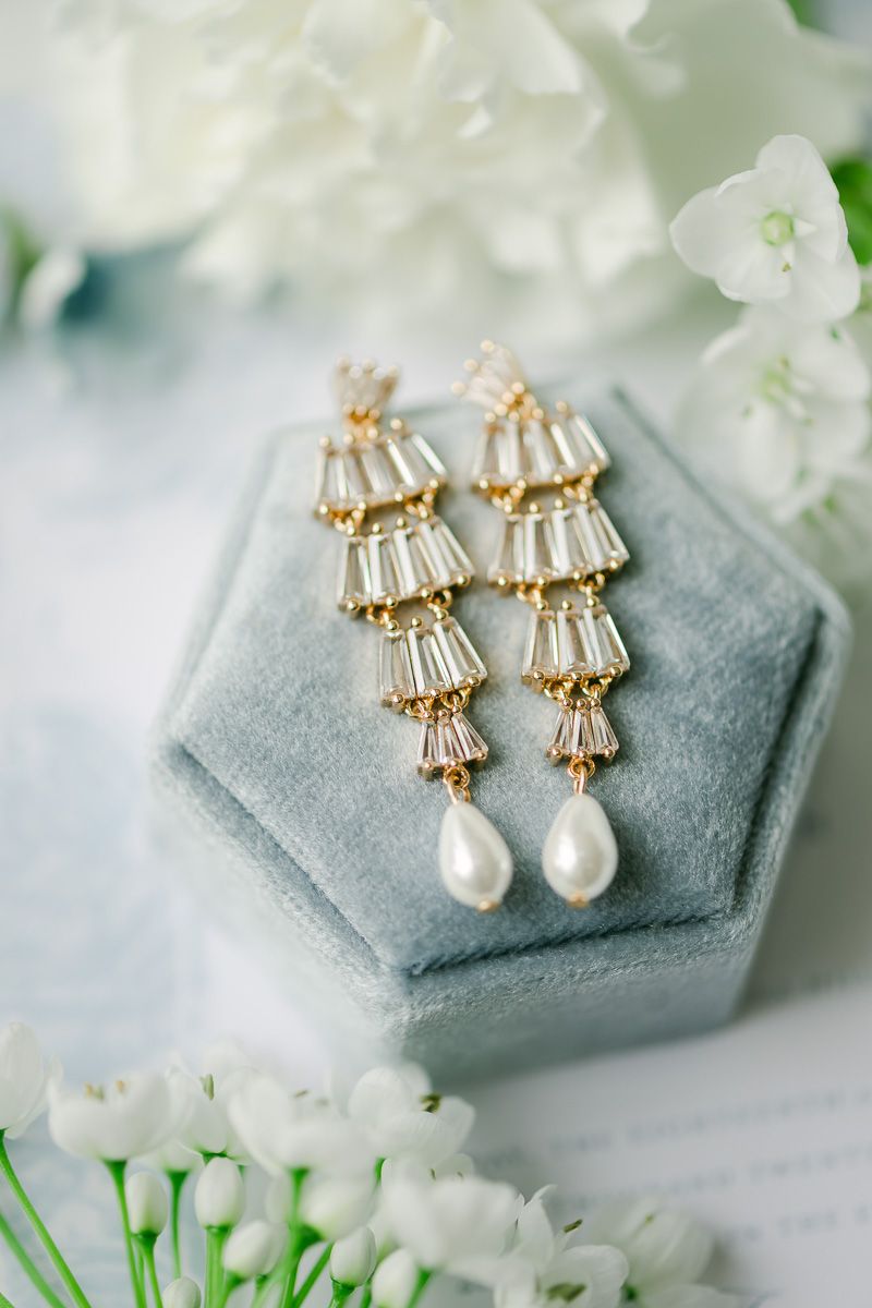 bridal earrings on blue box
