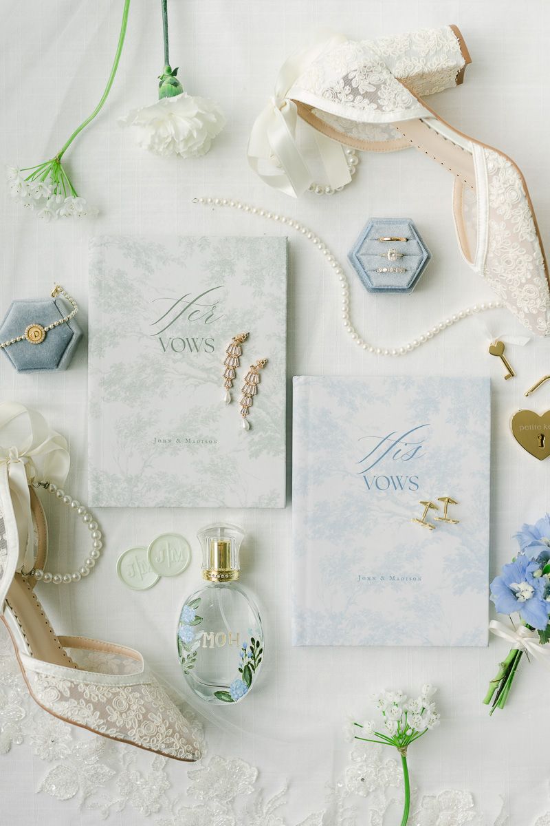 vow books with blue bridal details