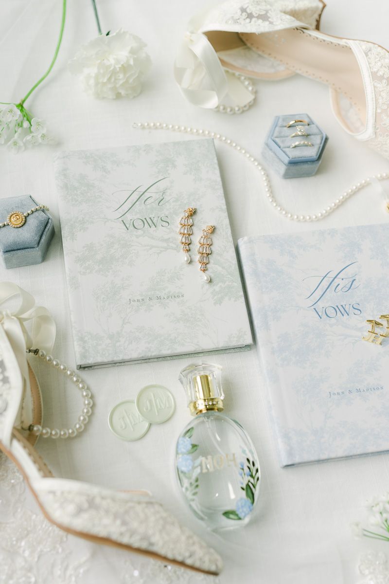 vow books with wedding shoes and blue bridal details