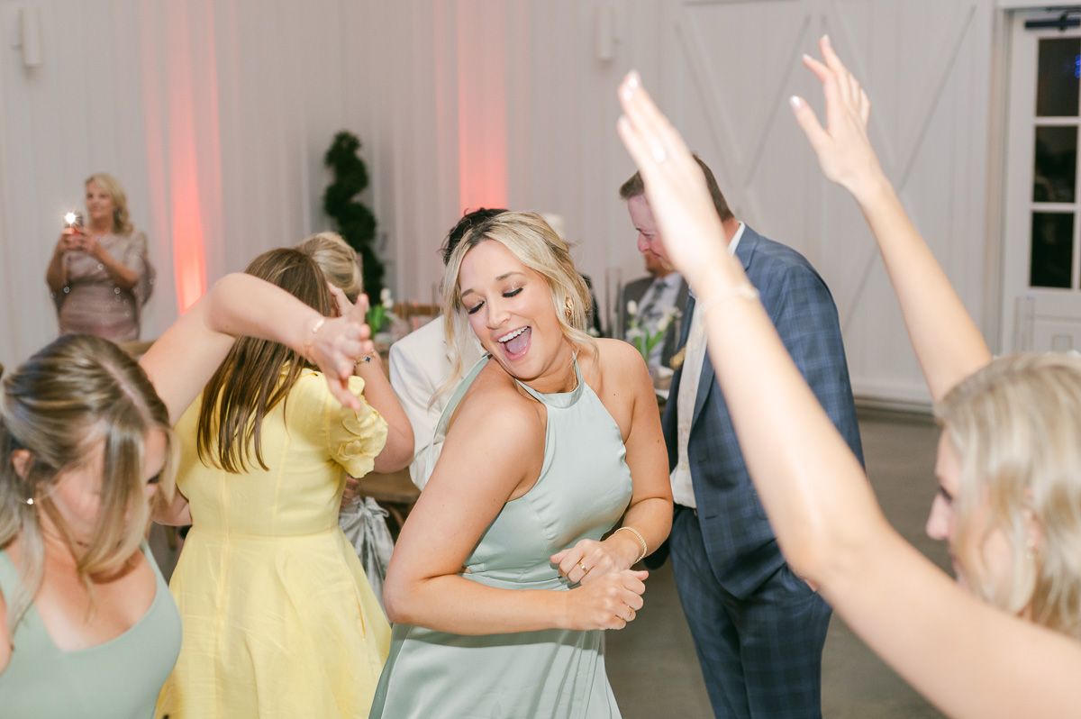 guests dancing at wedding reception 