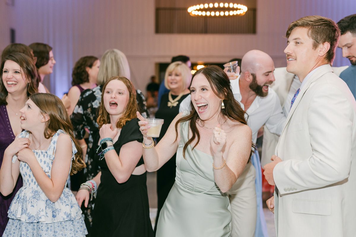 guests dancing at wedding reception 