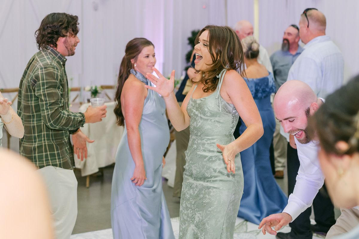 guests dancing at wedding reception 