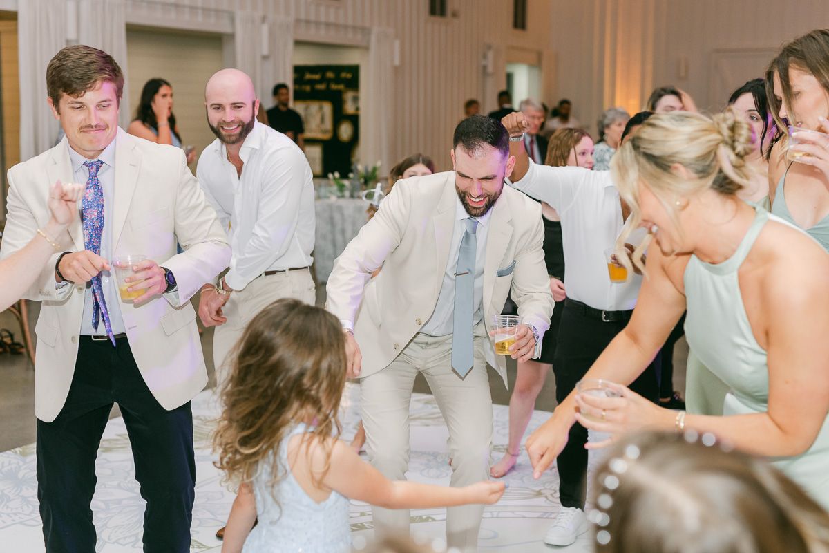 guests dancing at wedding reception 