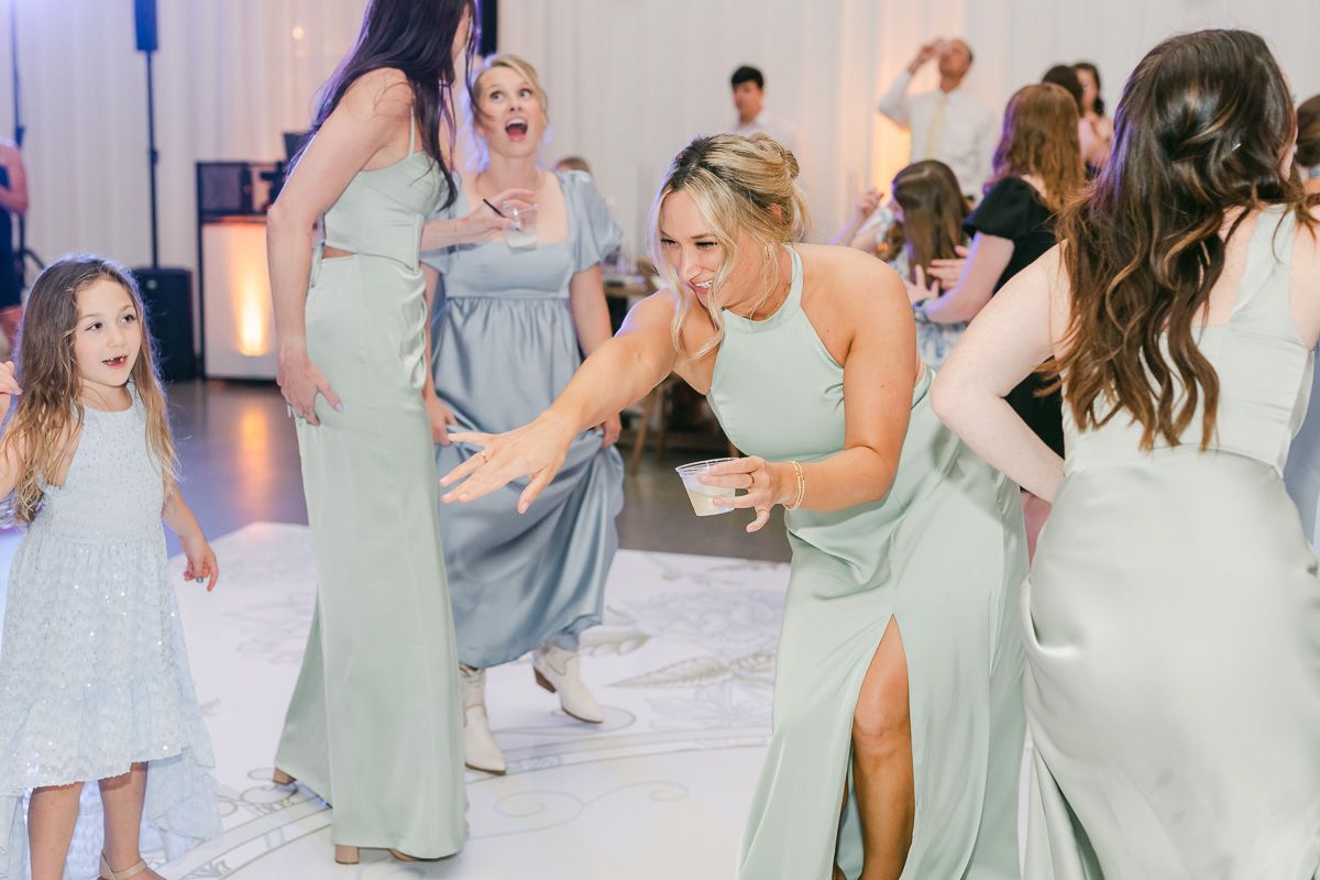guests dancing at wedding reception 