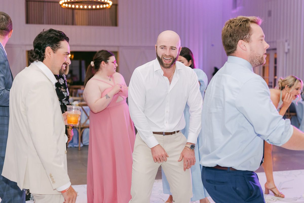 guests dancing at wedding reception 