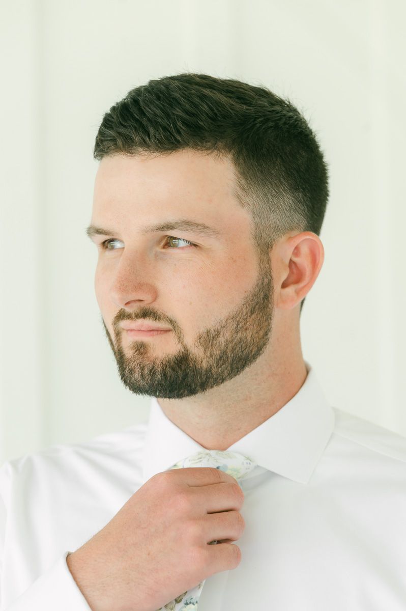 groom getting ready for wedding in Montgomery, Tx