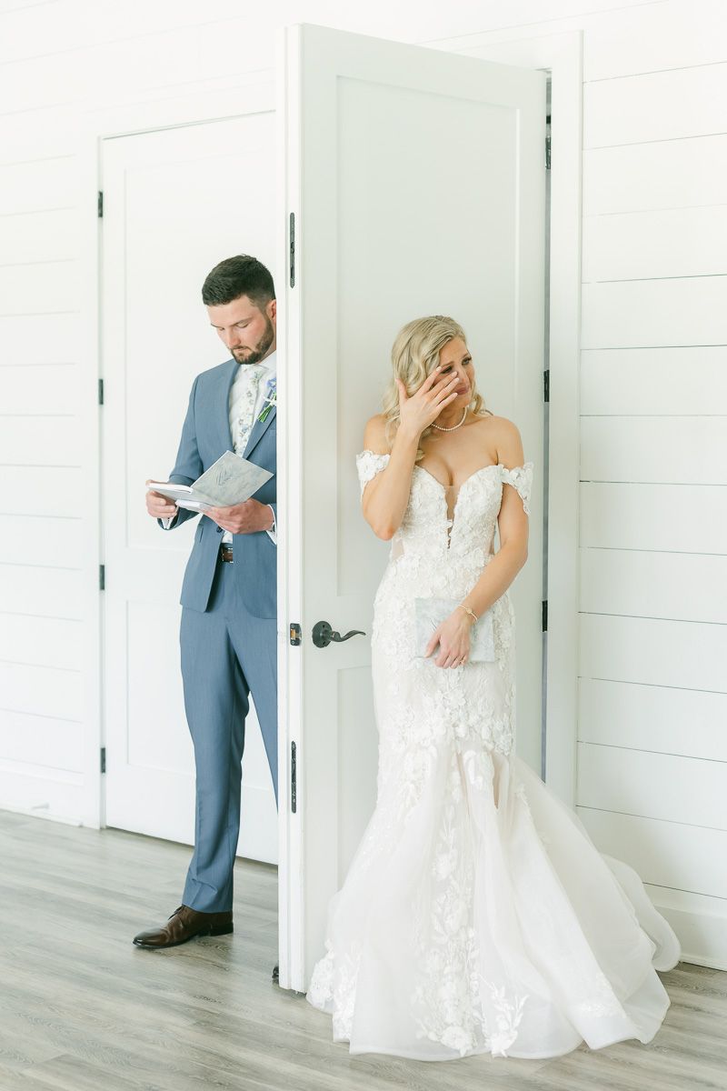 bride and groom reading private vows