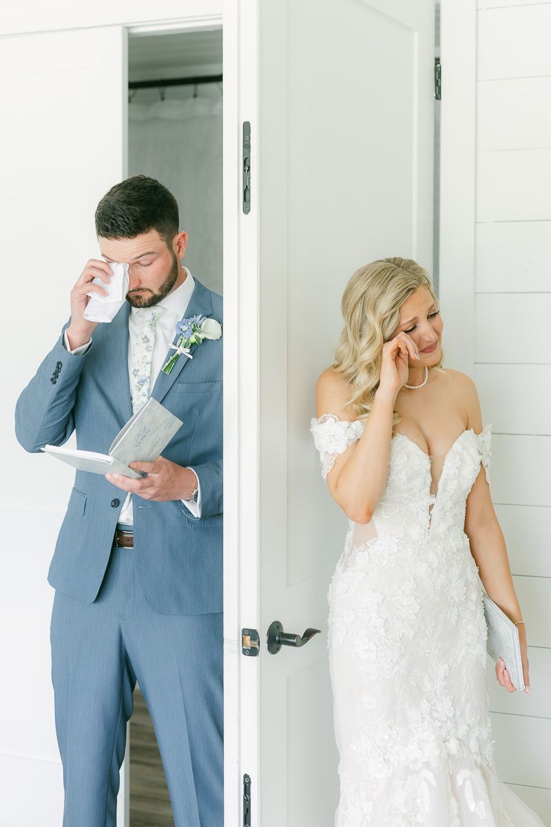 bride and groom reading private vows