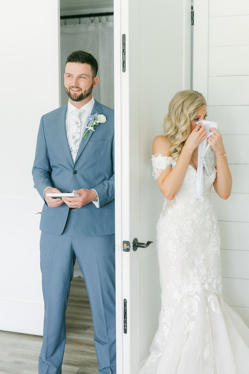 bride and groom reading private vows