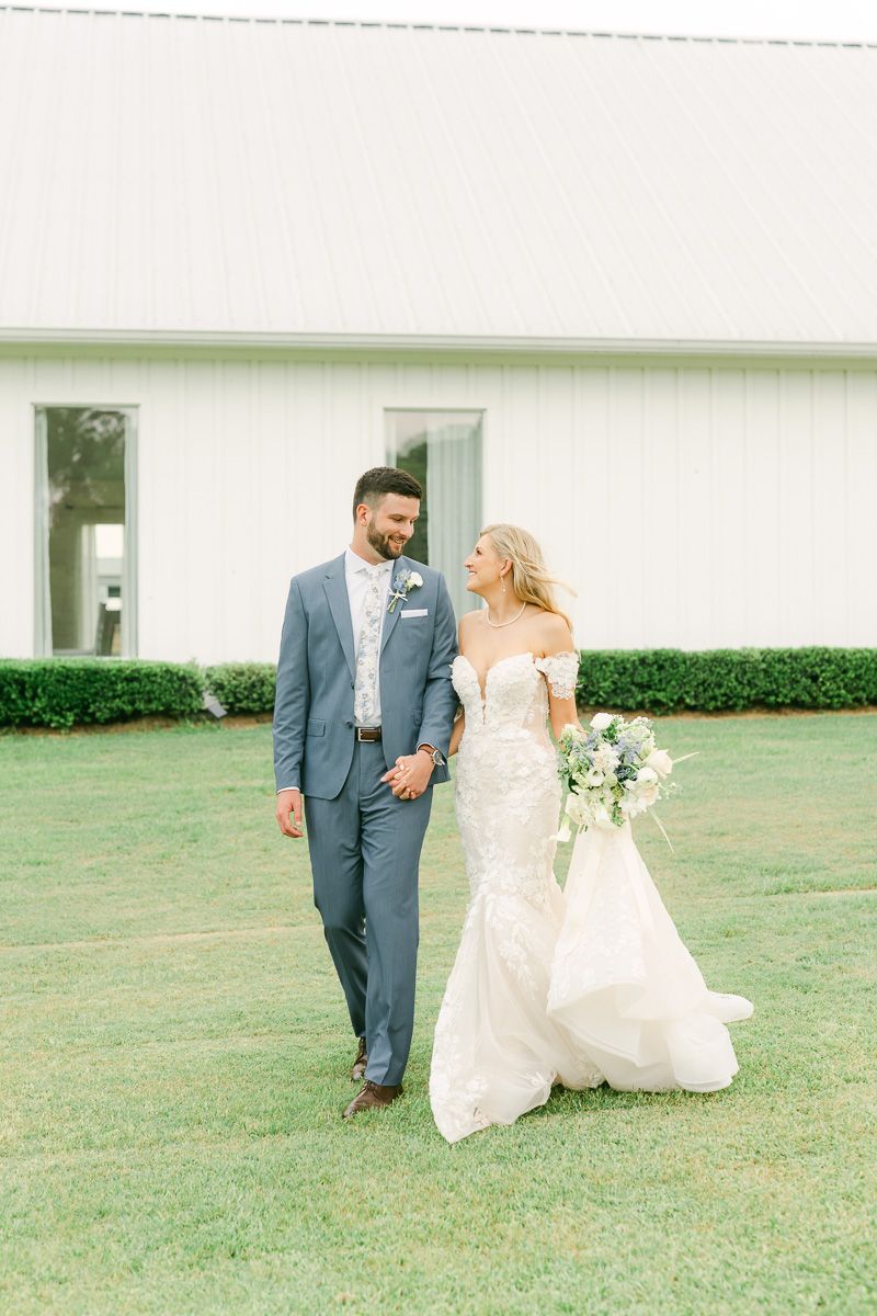 bride and groom walking at their wedding in Montgomery, Tx