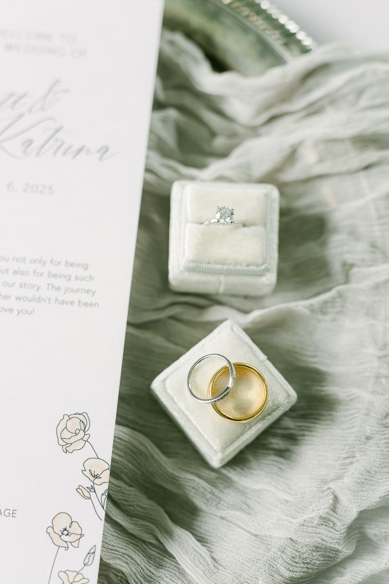 white ring box with gold rings