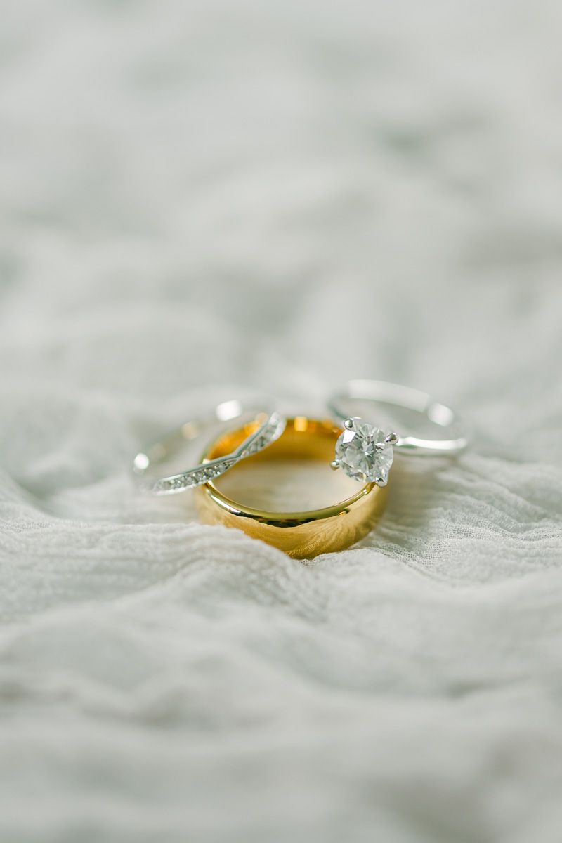 wedding rings on grey fabric