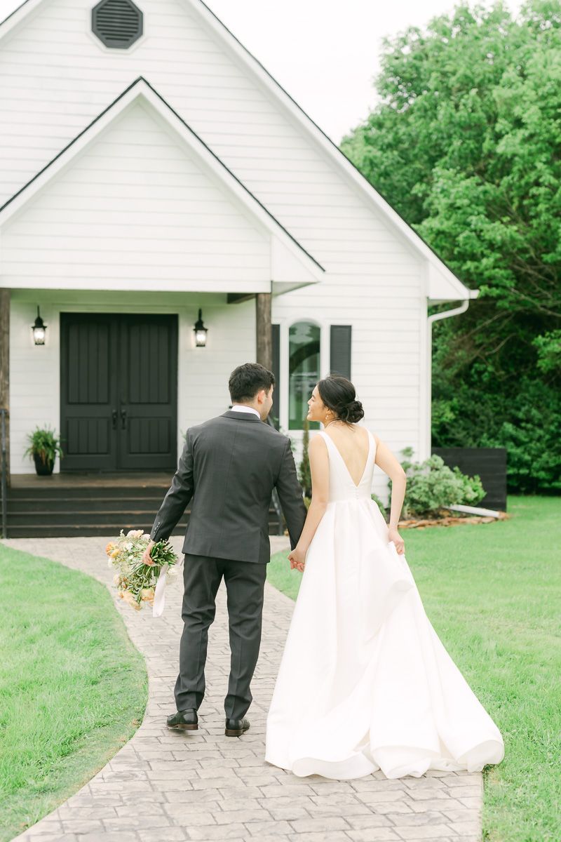 couple walking at their wedding in Plantersville, Tx
