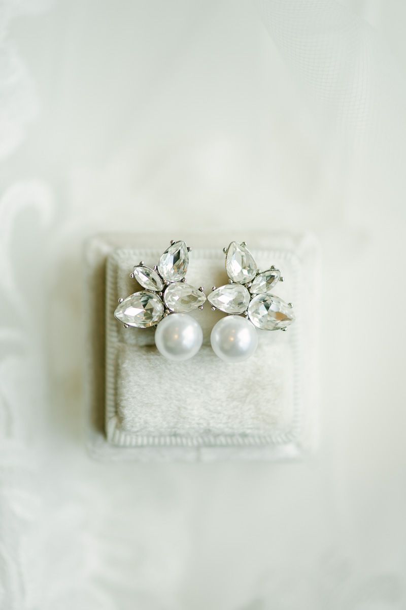 bridal earrings on white ring box