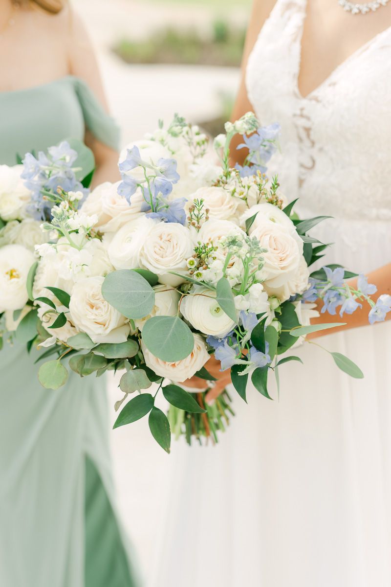 wedding bouquet with white flowers and pops of blue