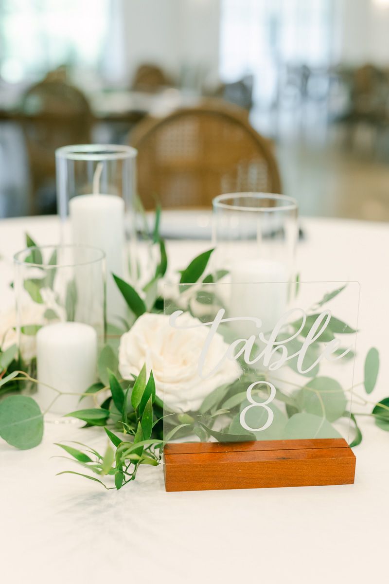 wedding reception centerpiece with greenery