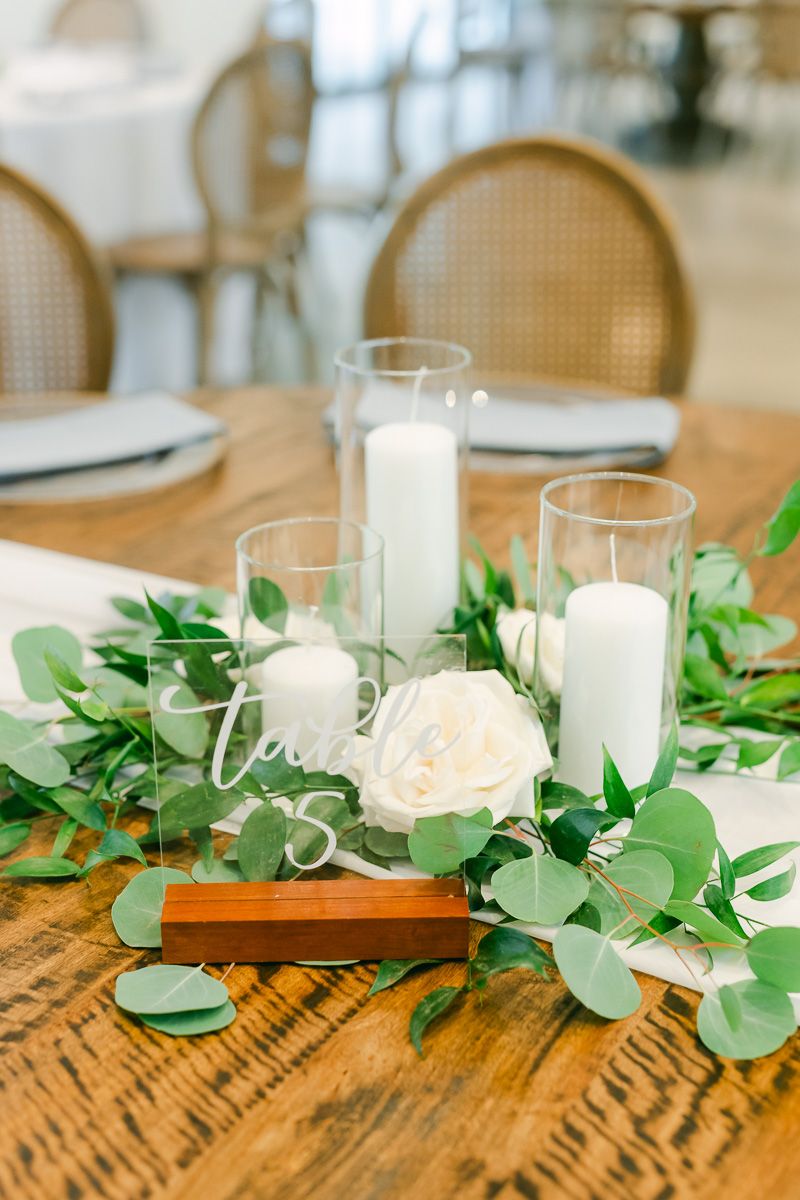 wedding reception centerpiece with greenery