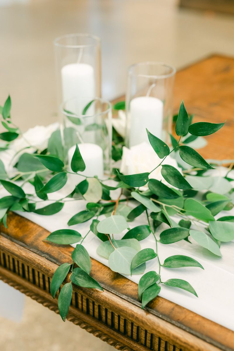 wedding reception centerpiece with greenery