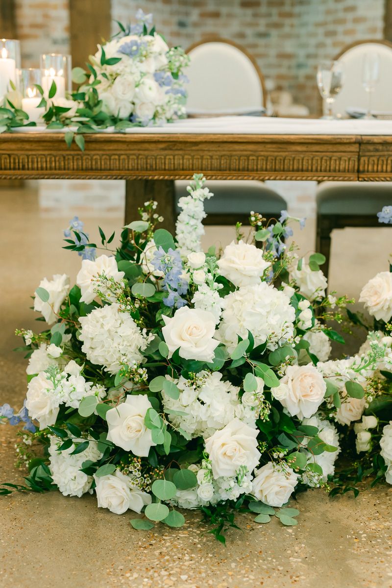 wedding reception white flowers with greenery
