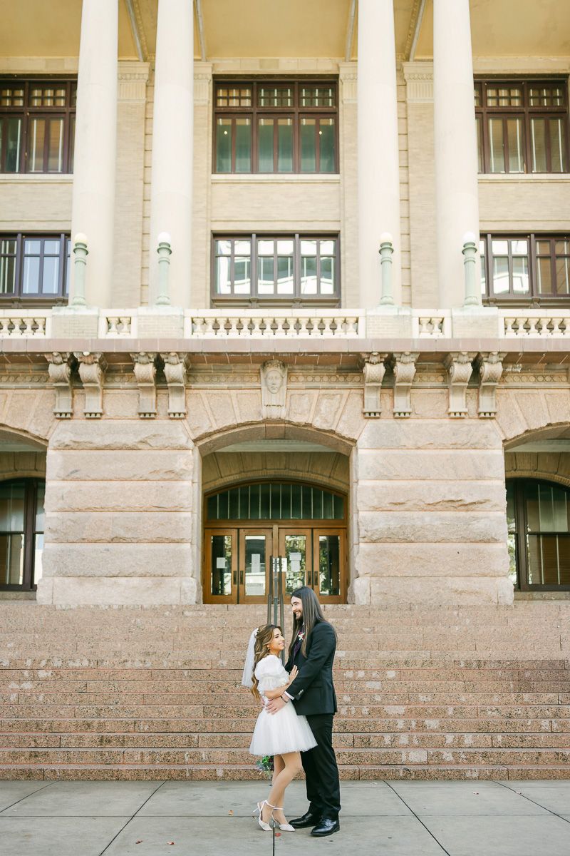 Couple outside the 1910 Harris County Courthouse in Houston