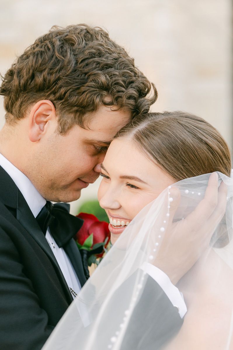 bride and groom posing for photos after wedding ceremony