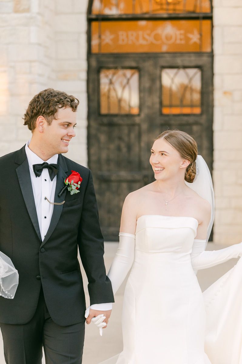 bride and groom posing for photos after wedding ceremony