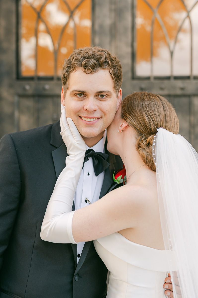 bride and groom posing for photos after wedding ceremony