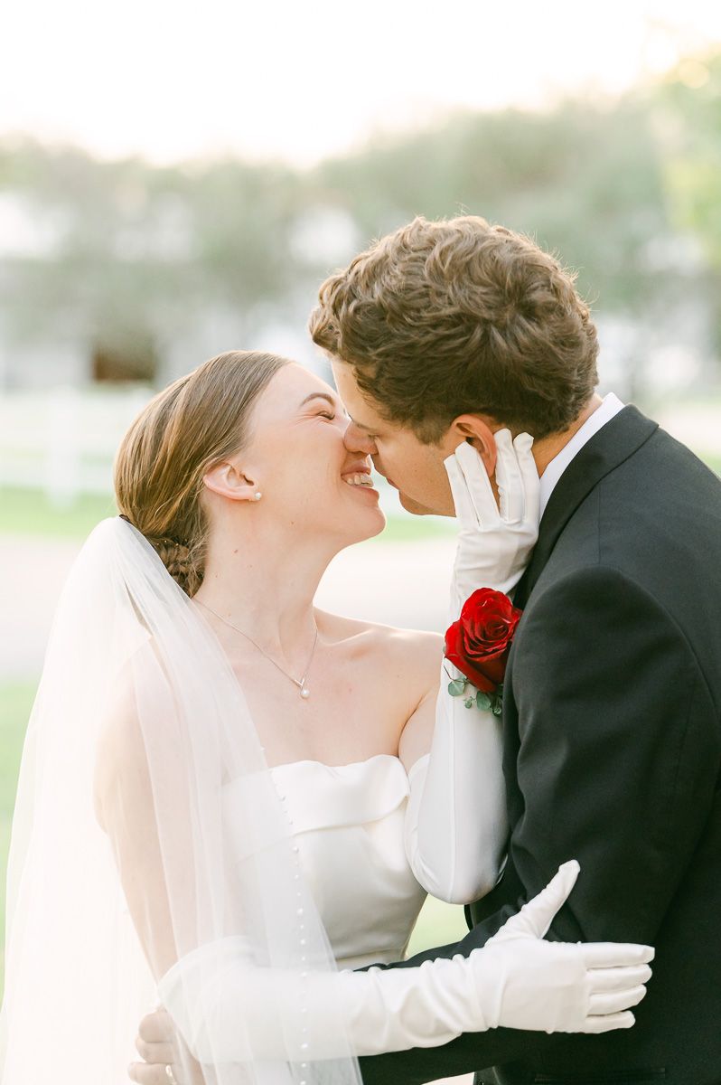 bride and groom posing for photos after wedding ceremony
