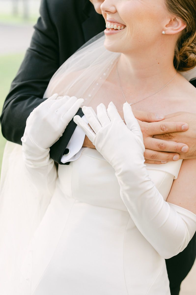 bride and groom posing for photos after wedding ceremony