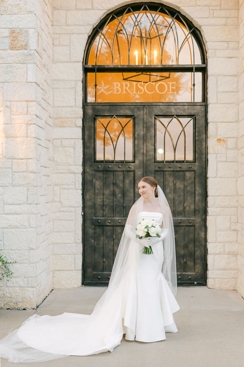 bride in classic wedding dress and long veil