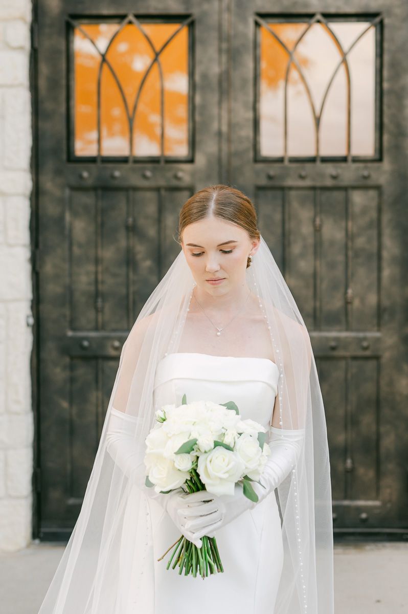 bride in classic wedding dress and long veil