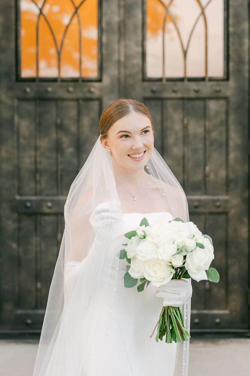 bride in classic wedding dress and long veil