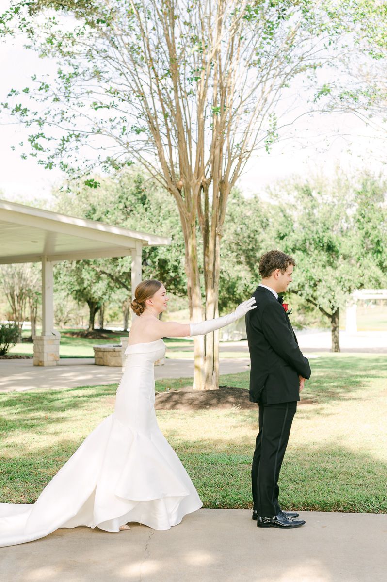couple sharing first look at black tie wedding at Briscoe Manor