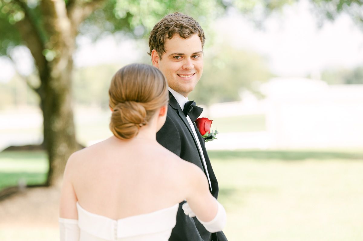 couple sharing first look at black tie wedding at Briscoe Manor