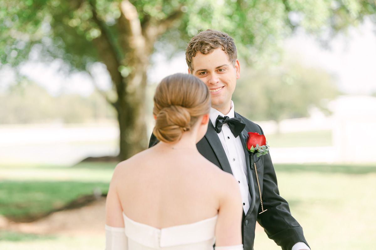 couple sharing first look at black tie wedding at Briscoe Manor