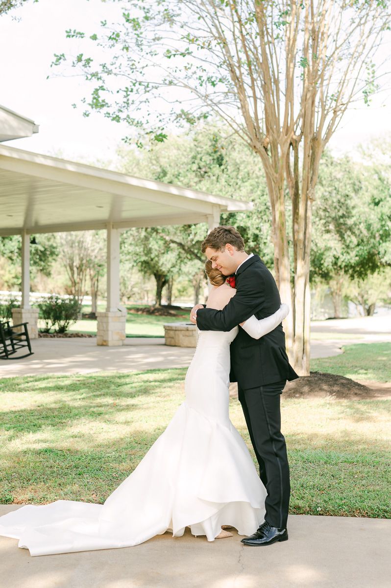 couple sharing first look at black tie wedding at Briscoe Manor