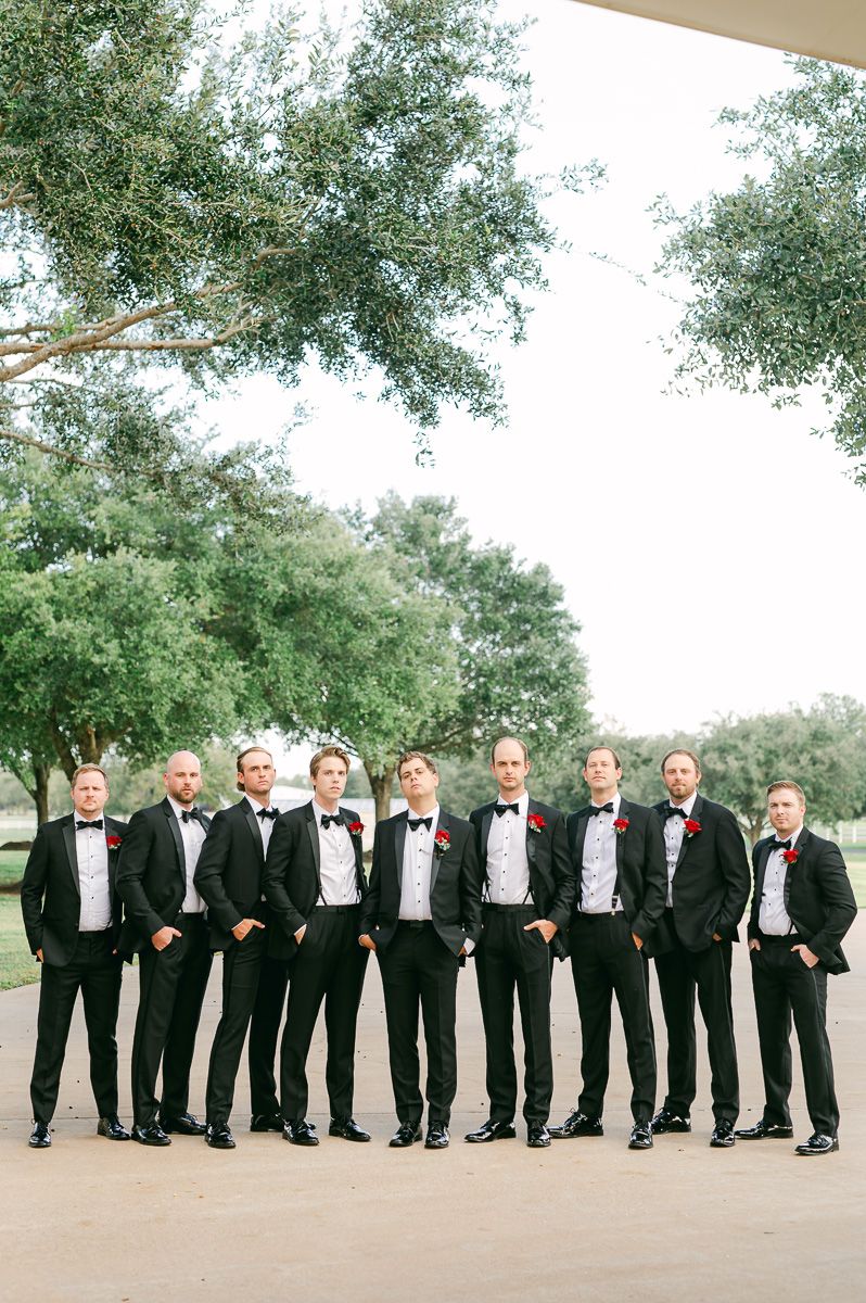 groomsmen in black suits in Richmond, Tx